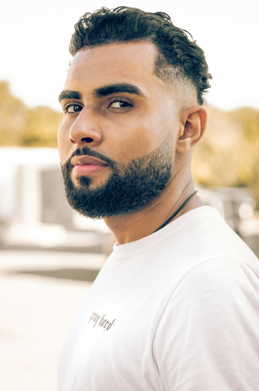 Portrait of a man with short hair and a beard